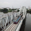 New bridge in HCM City crossing Sài Gòn River opens to train traffic