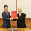 Politburo assigns tasks to two Politburo members