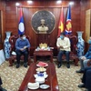 Laos joins hands with Vietnam to fight COVID-19