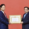 Former Prime Minister presented with 55-year Party membership badge