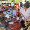 Vietnamese doctors provide free health check-ups for people in Laos