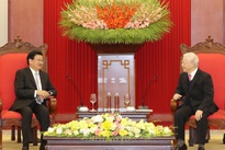 Party, State leader receives visiting Laos PM