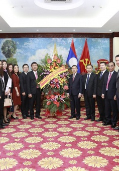 Thứ trưởng Ngoại giao Nguyễn Minh Vũ chúc mừng Quốc khánh CHDCND Lào