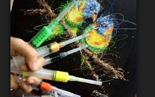 What are some techniques for creating artwork using syringes?