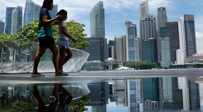 Singapore cuts growth outlook as trade war ripples across region