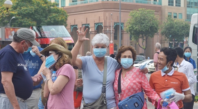 Locals, tourists receives free masks in HCM City
