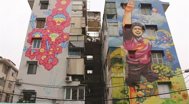 Colourful murals cover old buildings in HCM City